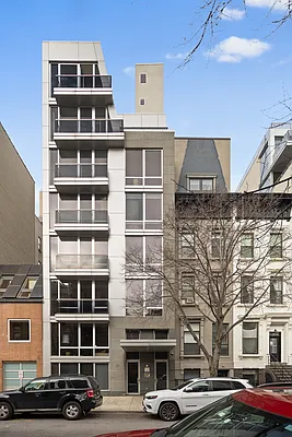 129 West 123rd Street, Unit 3 Manhattan, NY 10027 - Photo 18 of 20 a front view of a building with parking space