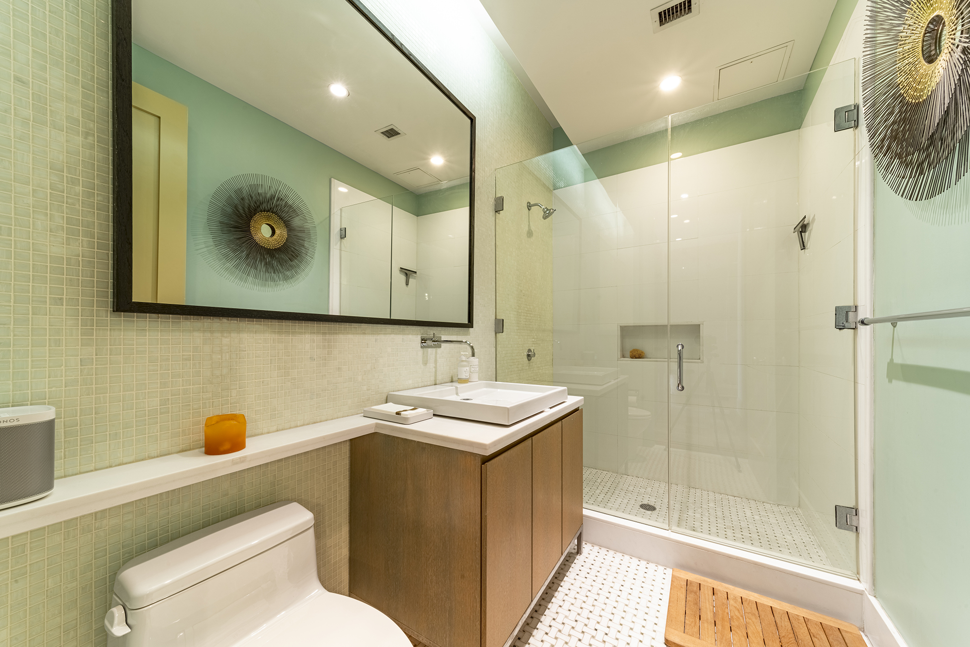 263 9th Avenue, Unit 3E Manhattan, NY 10001 - Photo 15 of 17 a bathroom with a sink a toilet and shower