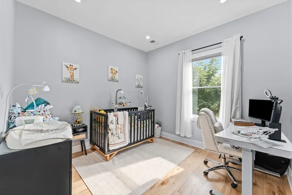 a bedroom with a workspace