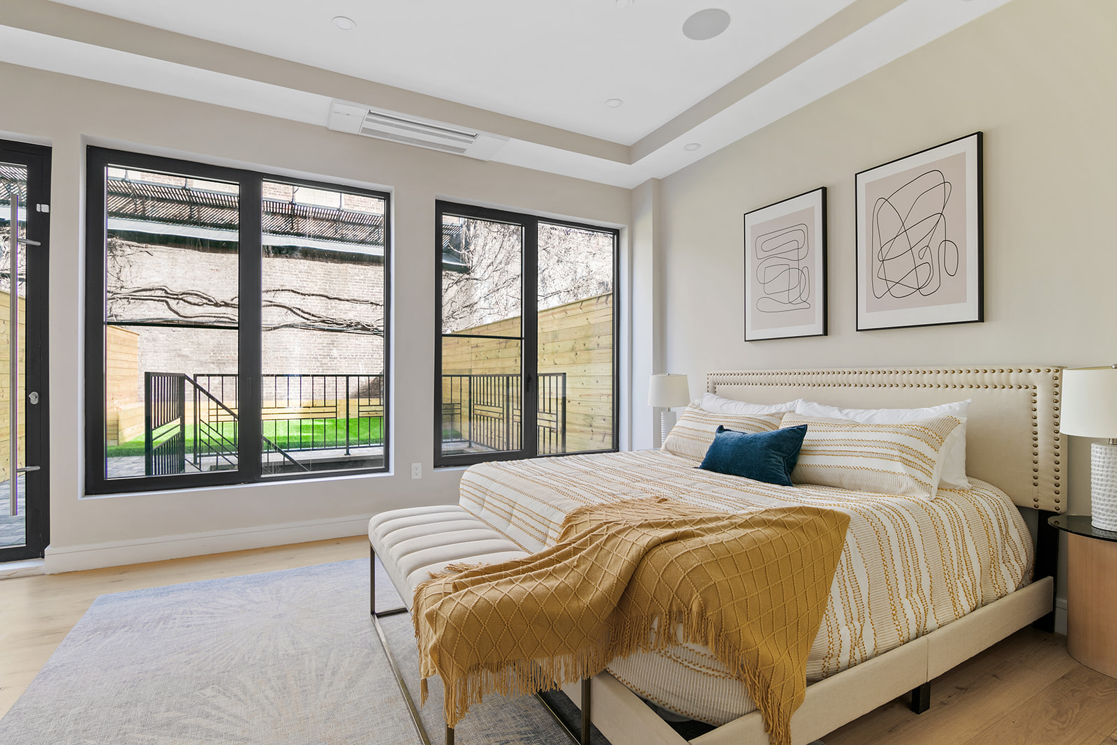 1251 Pacific Street, Unit 1A Brooklyn, NY 11216 - Photo 5 of 13 a bedroom with a bed and a large window