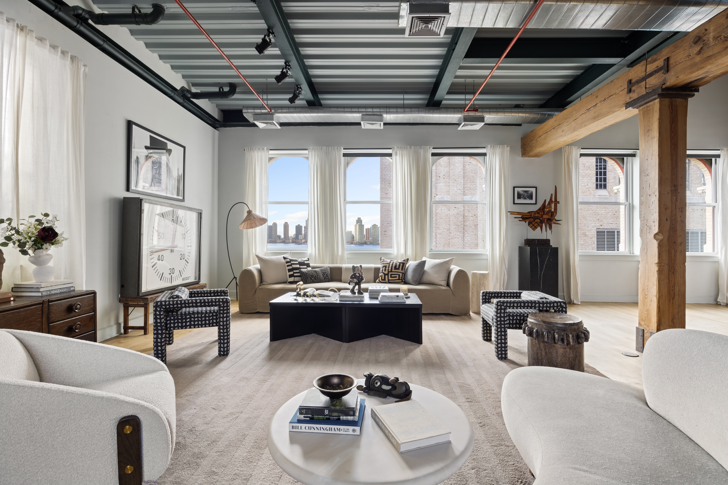 481 Washington Street, Unit PHS Manhattan, NY 10013 - Photo 9 of 20 a living room with furniture or couch and a chandelier