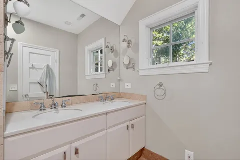 a view of a bathroom with tub and shower