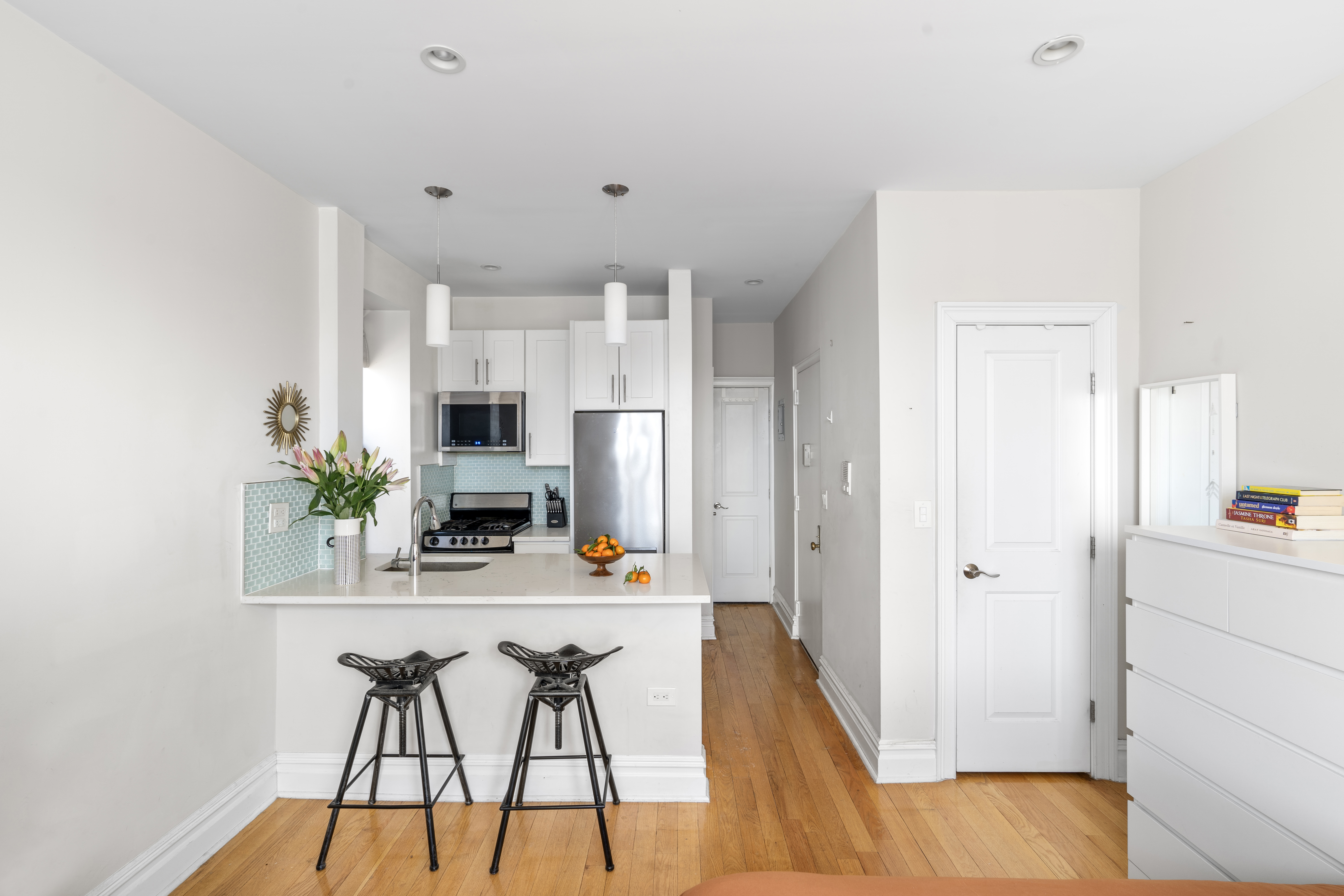 660 Riverside Drive, Unit 2A Manhattan, NY 10031 - Photo 3 of 6 a view of a hallway with dining room and wooden floor