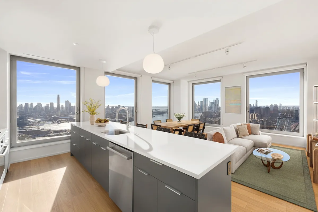 a large room with a large window and a couch