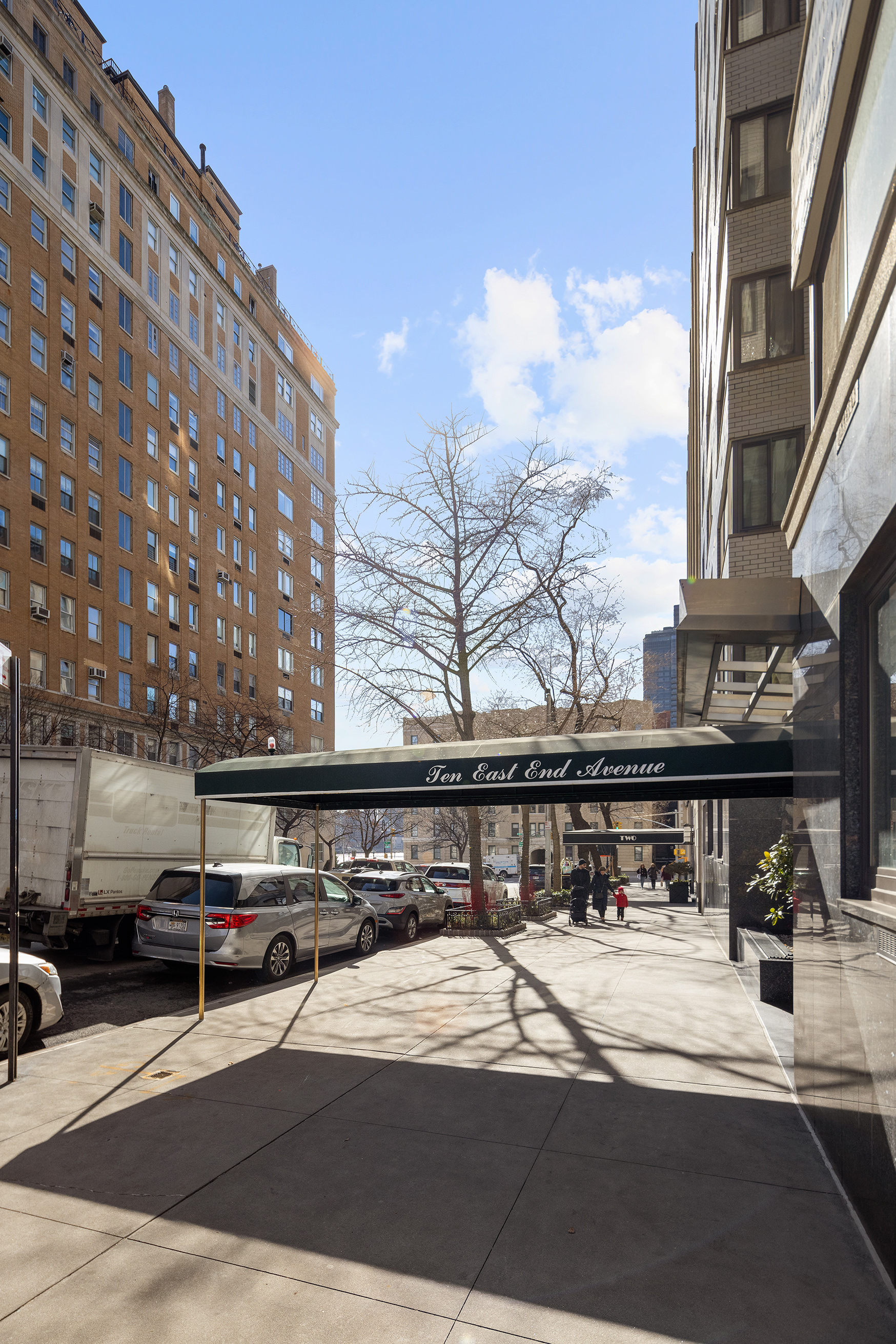 10 East End Avenue, Unit 18E Manhattan, NY 10075 - Photo 8 of 13 a view of building with cars