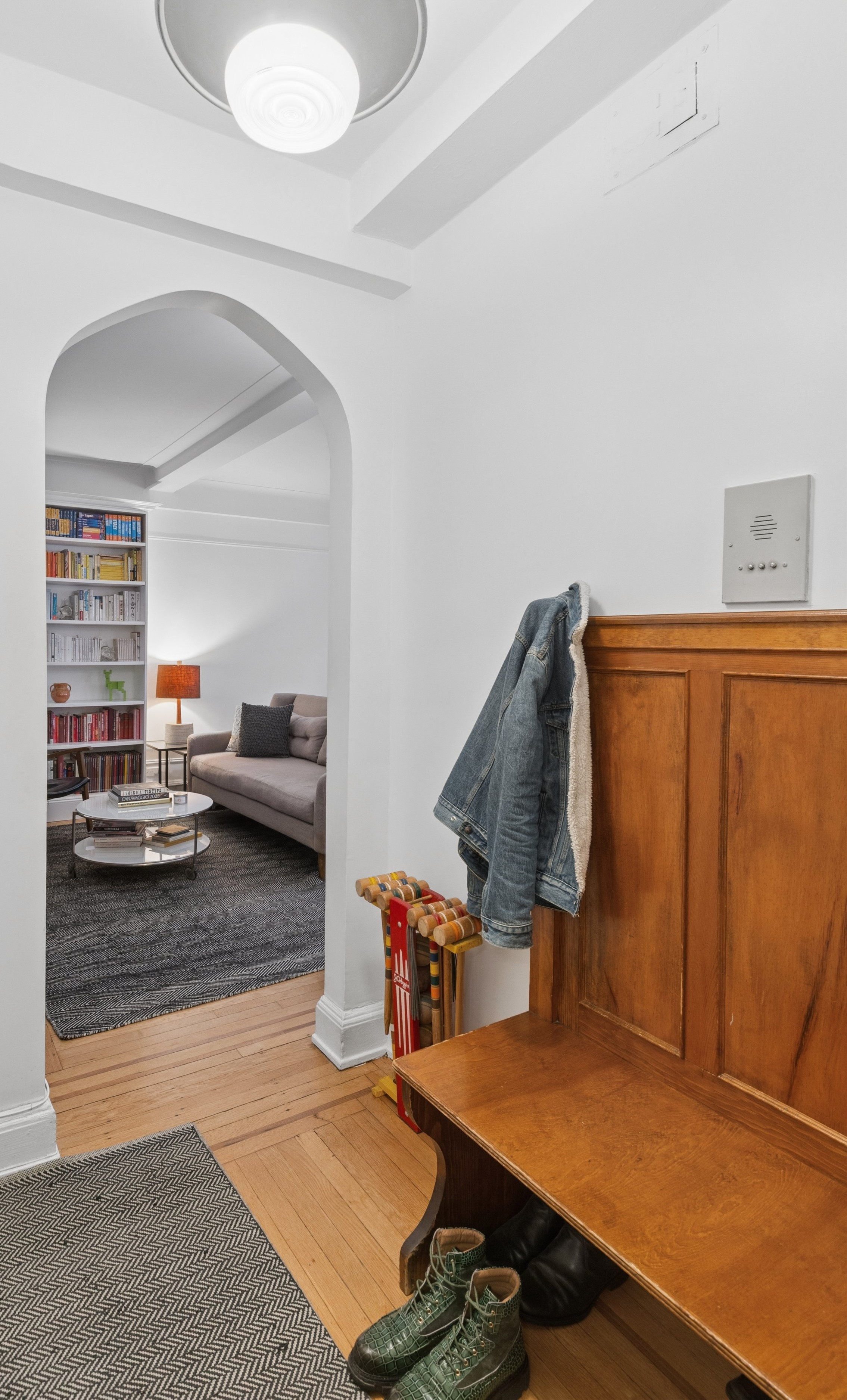 41 West 72nd Street, Unit 15E Manhattan, NY 10023 - Photo 3 of 12 a living room with furniture and a flat screen tv