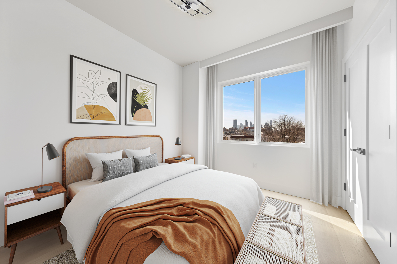 12-16 30th Avenue, Unit 303 Queens, NY 11102 - Photo 6 of 18 a bedroom with a bed and a painting on the wall
