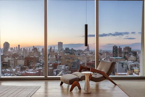 a view of a balcony with furniture