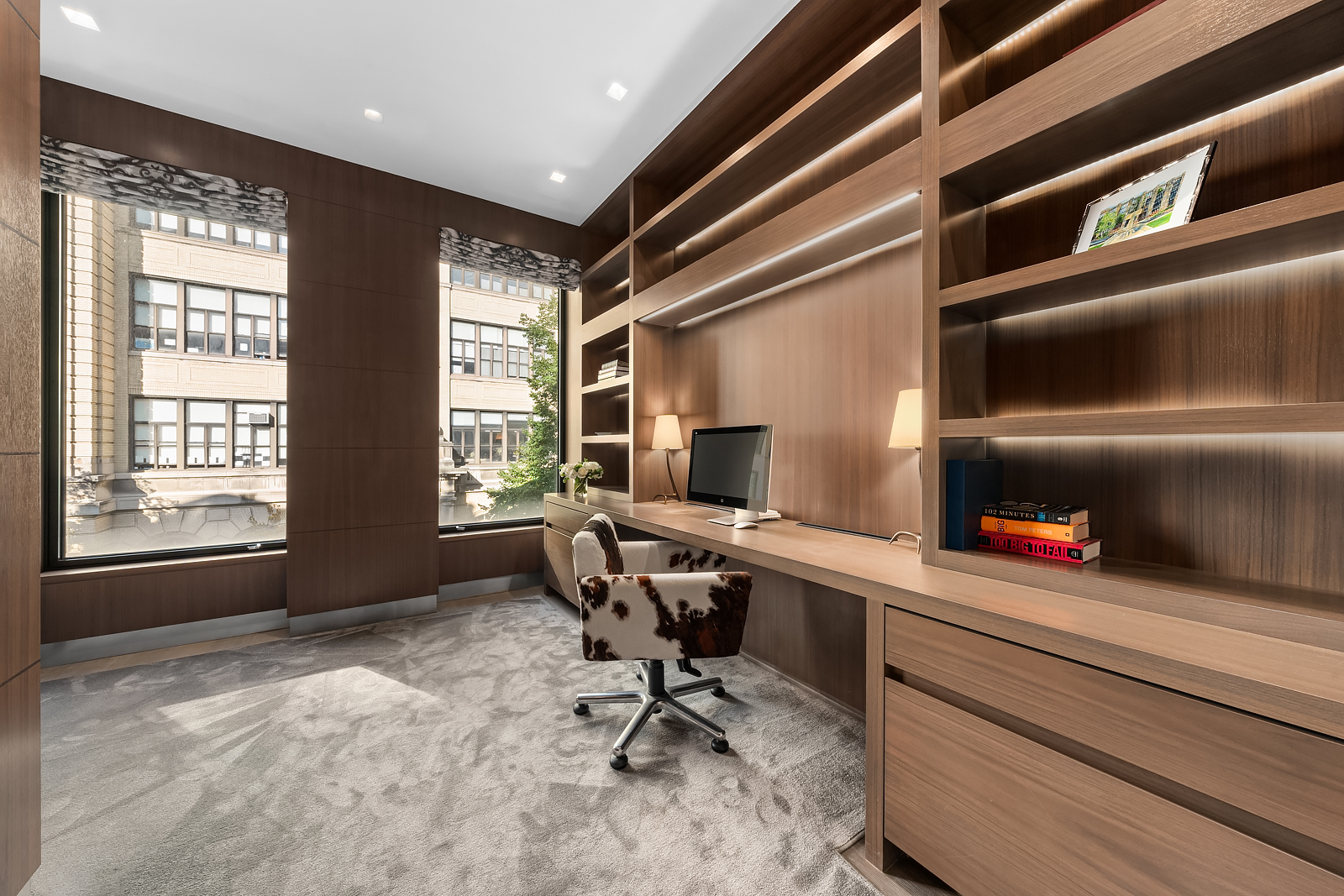 184 East 75th Street Manhattan, NY 10021 - Photo 11 of 20 a view of a workspace with furniture and a window