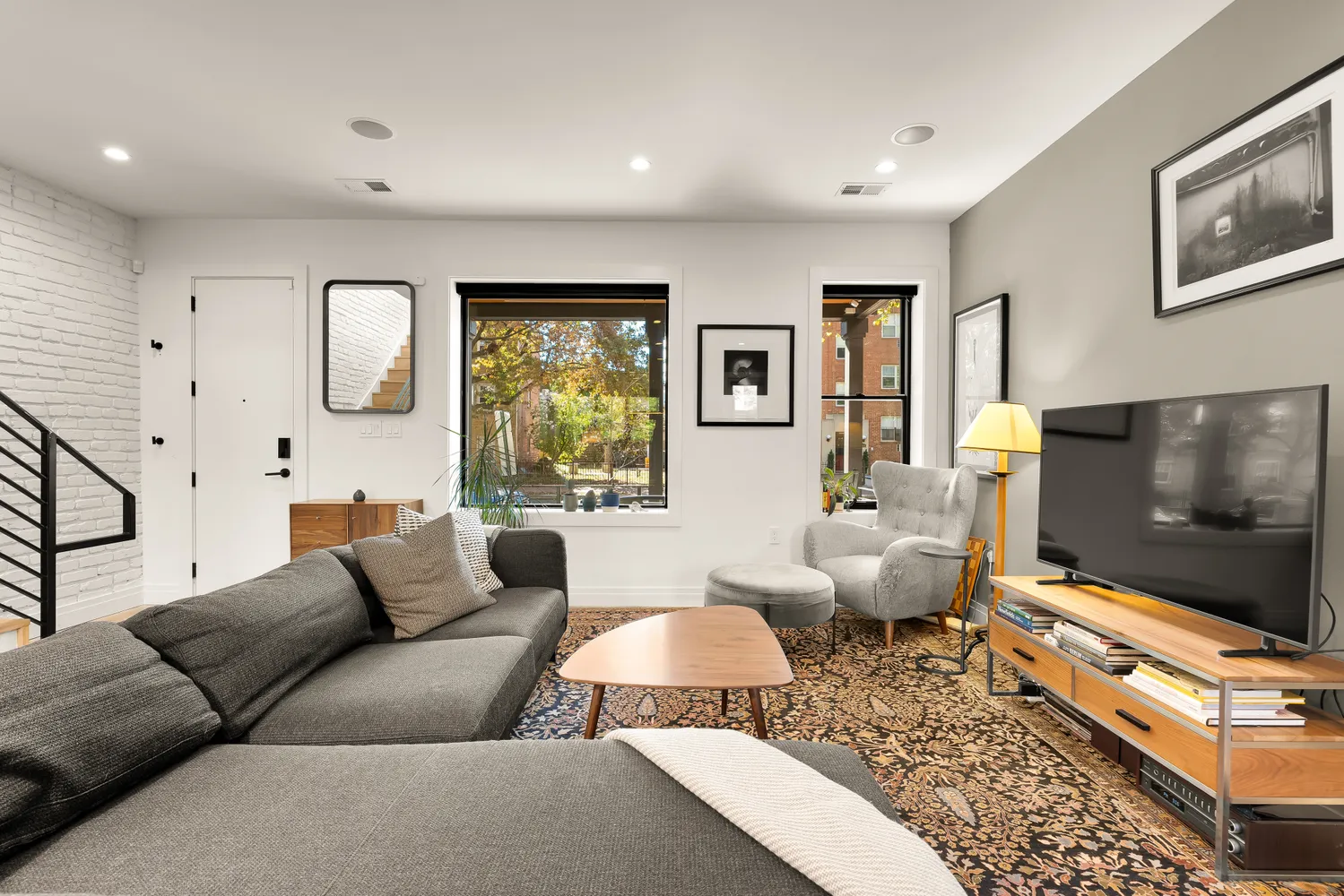 a living room with furniture and a flat screen tv
