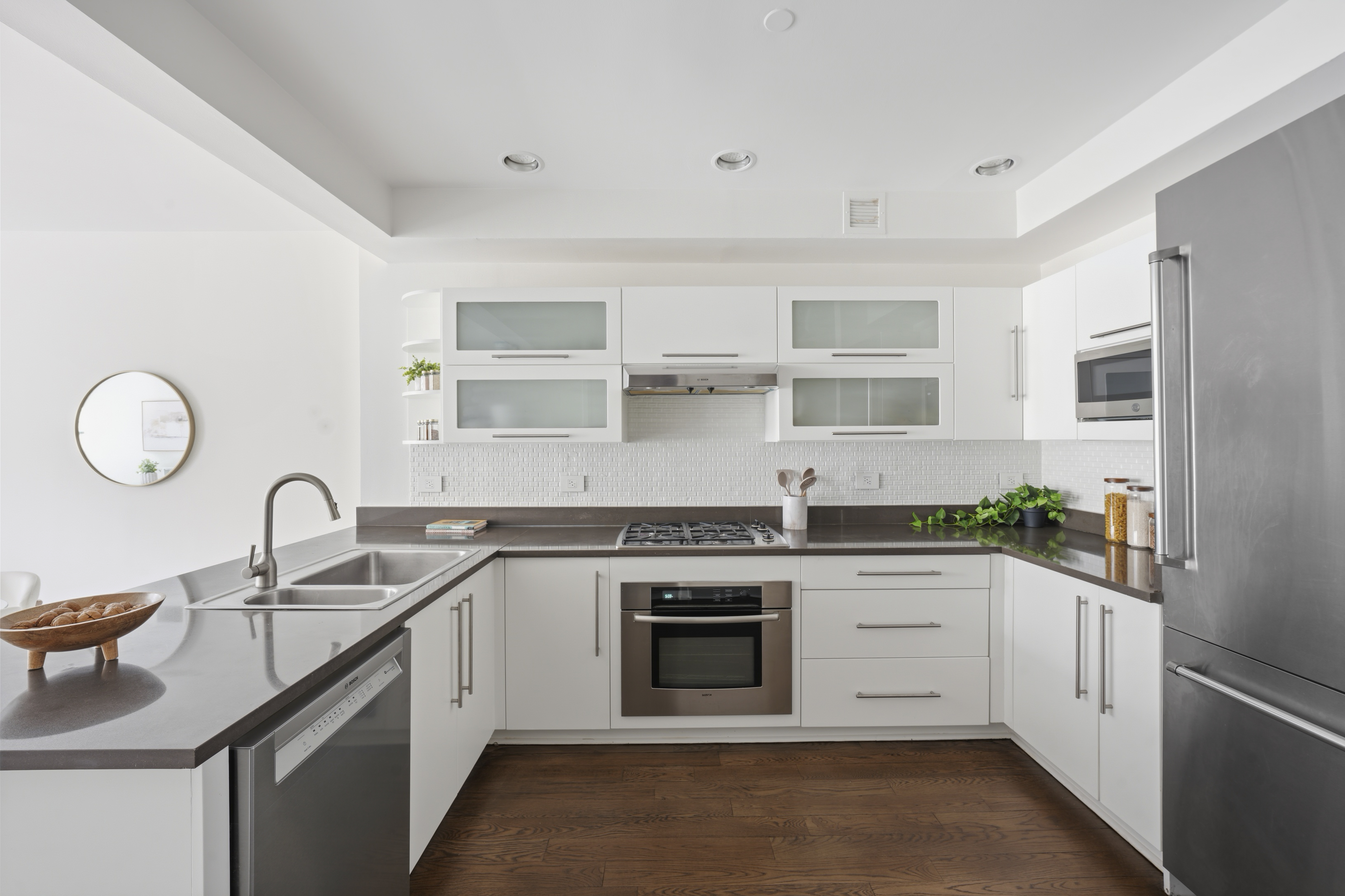 257 West 117th Street, Unit 2F Manhattan, NY 10026 - Photo 6 of 21 a kitchen with a sink stove and cabinets