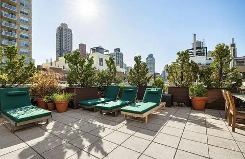 a view of a terrace with sitting area
