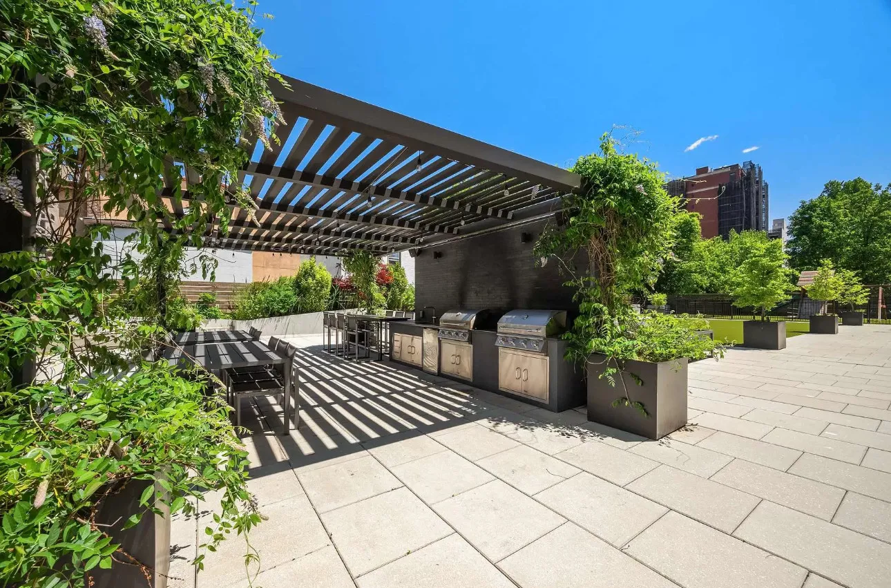 a view of a backyard with sitting area