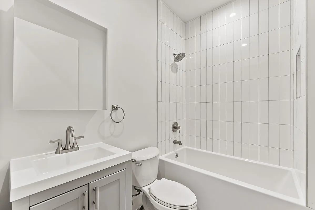 30 Belvidere Street, Unit 1B Brooklyn, NY 11206 - Photo 6 of 6 a bathroom with a sink toilet and bathtub