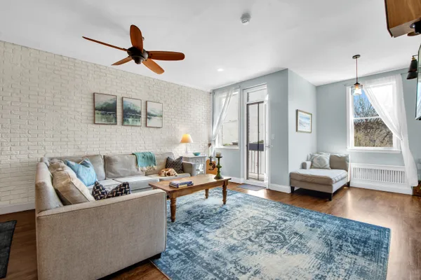 a living room with furniture and a window