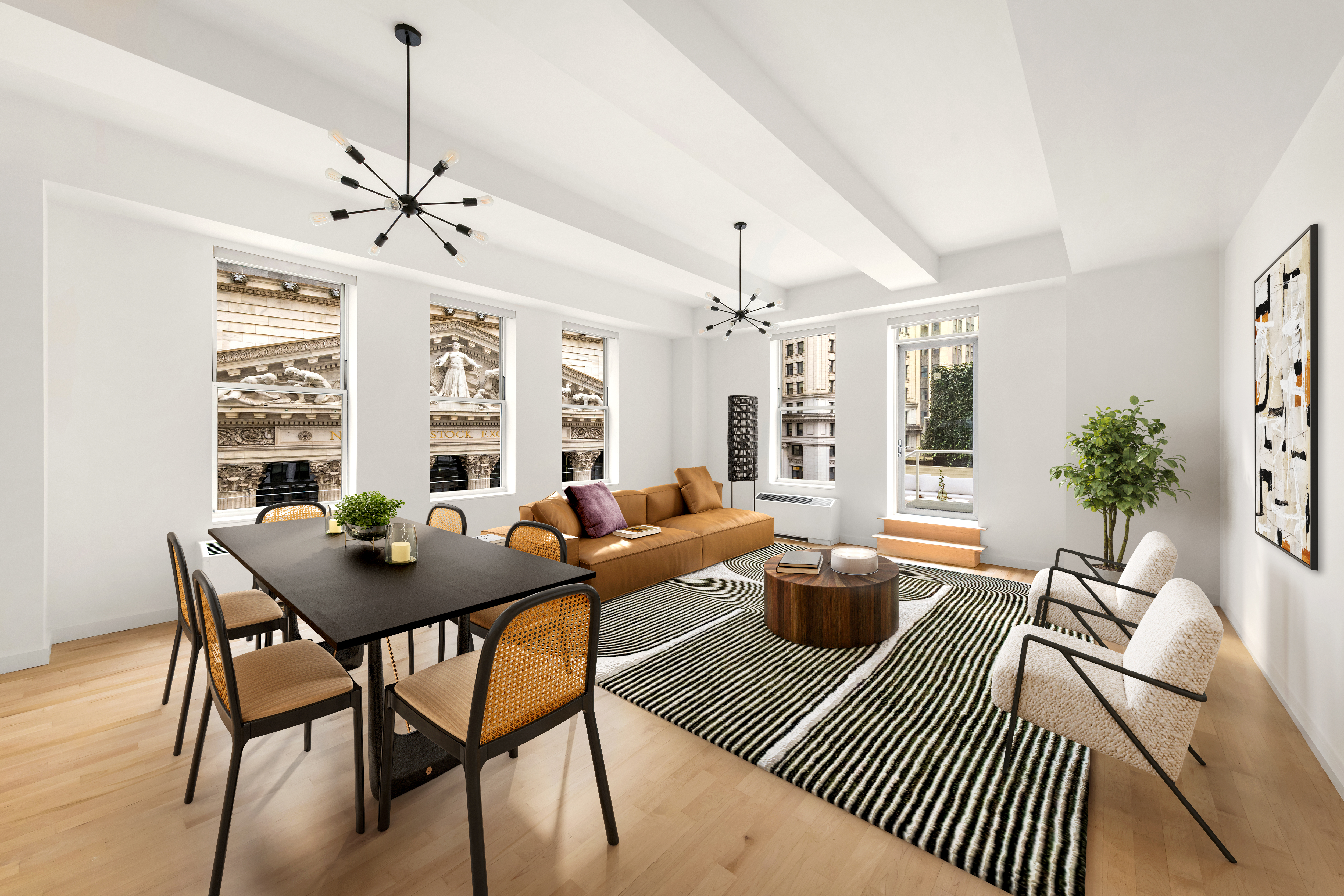 a living room with furniture a chandelier and a table