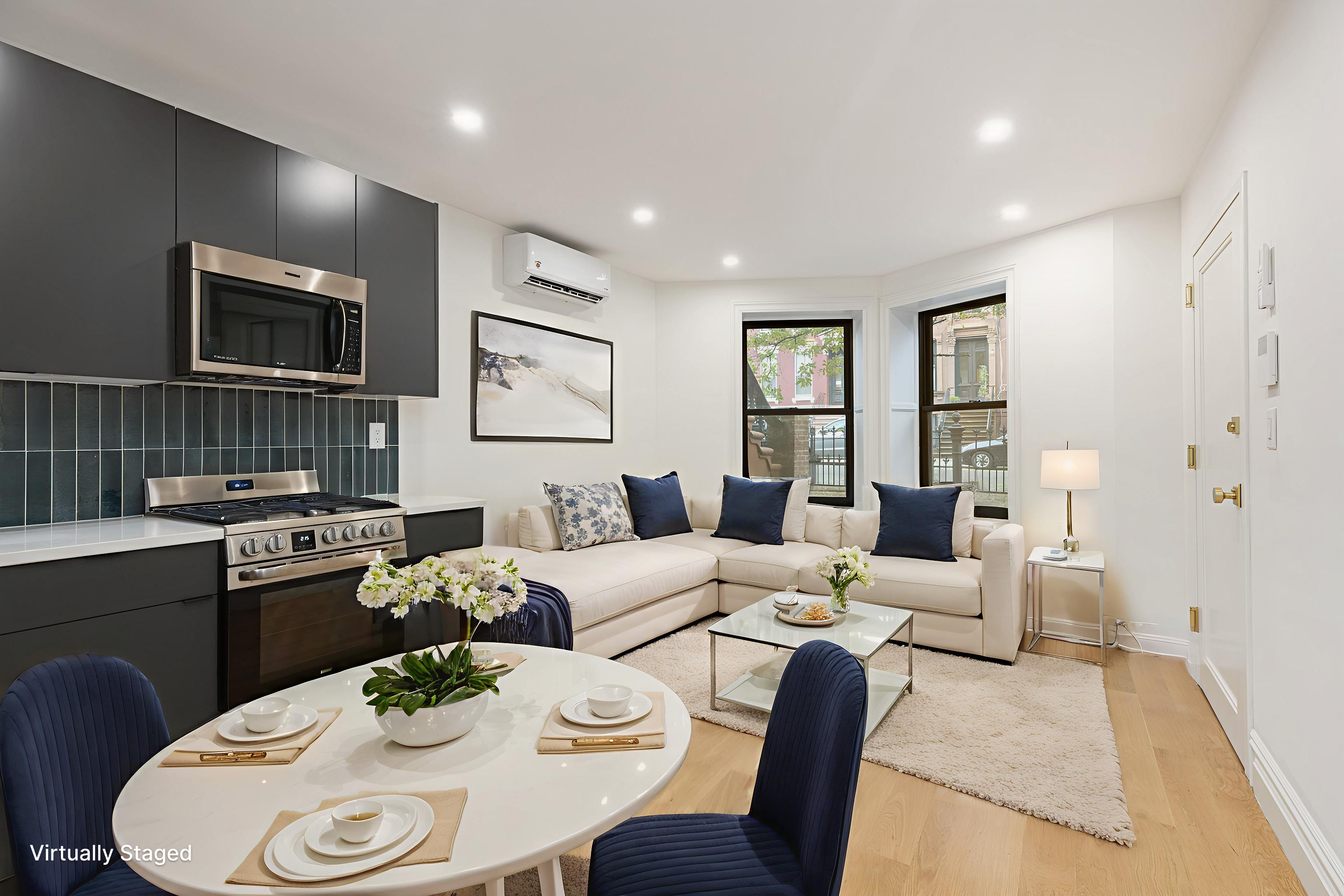 15 Verona Place, Unit GARDEN Brooklyn, NY 11216 - Photo 1 of 14 a living room with furniture kitchen view and a wooden floor