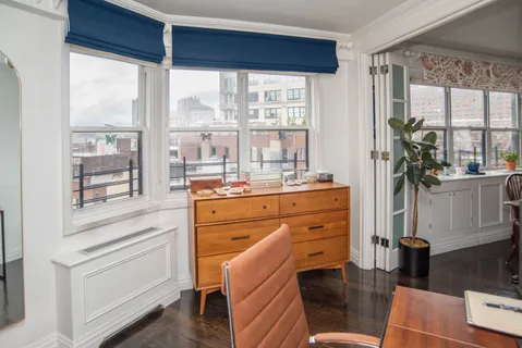 a room with a bed and a window