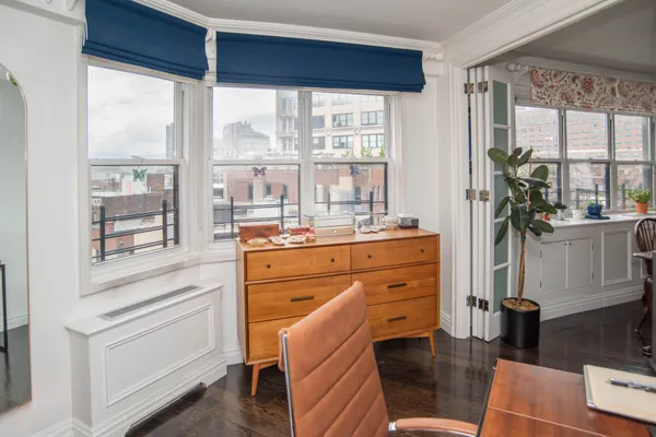 a room with a bed and a window