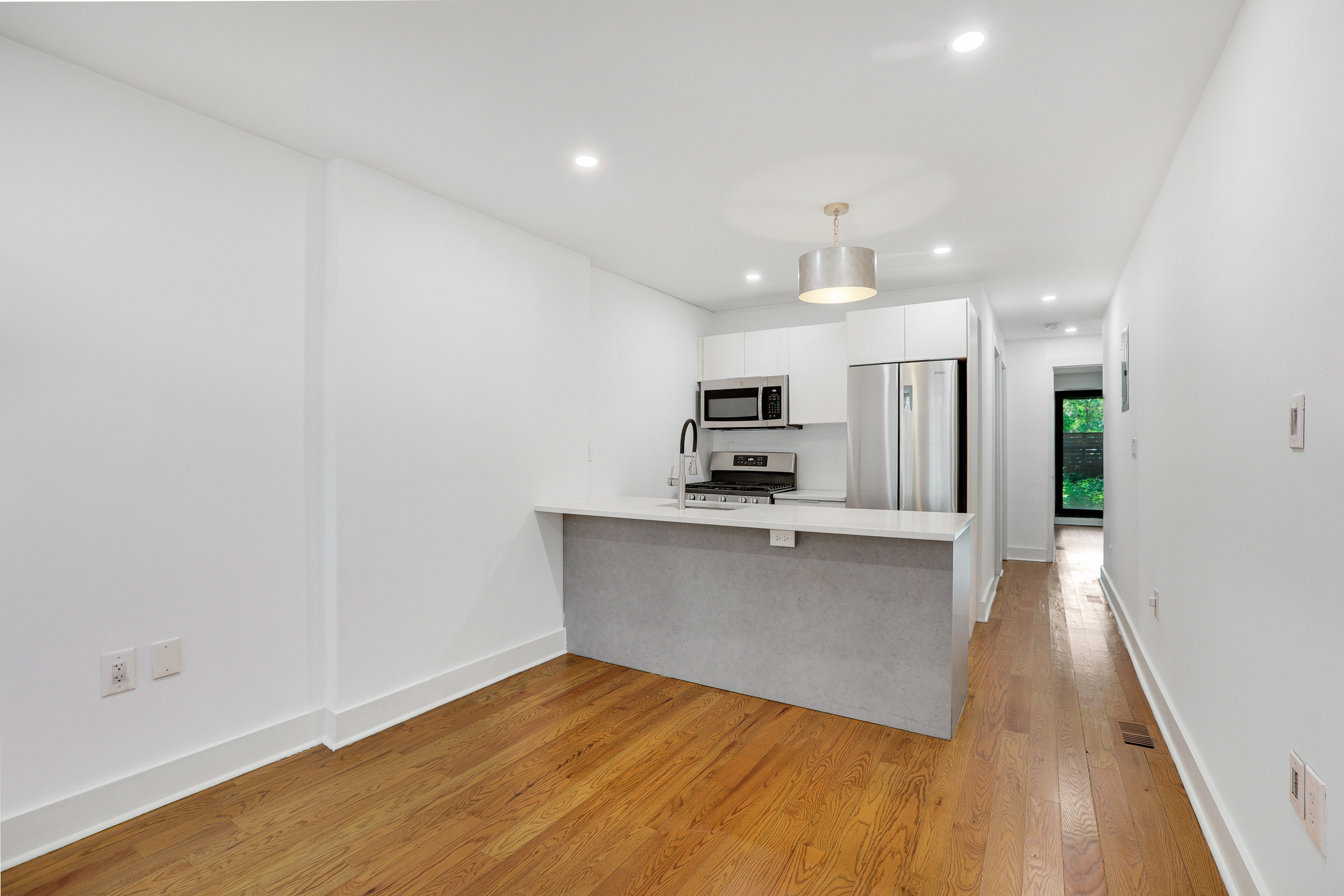 846 Hancock Street, Unit GARDEN Brooklyn, NY 11233 - Photo 1 of 17 a view of kitchen with wooden floor