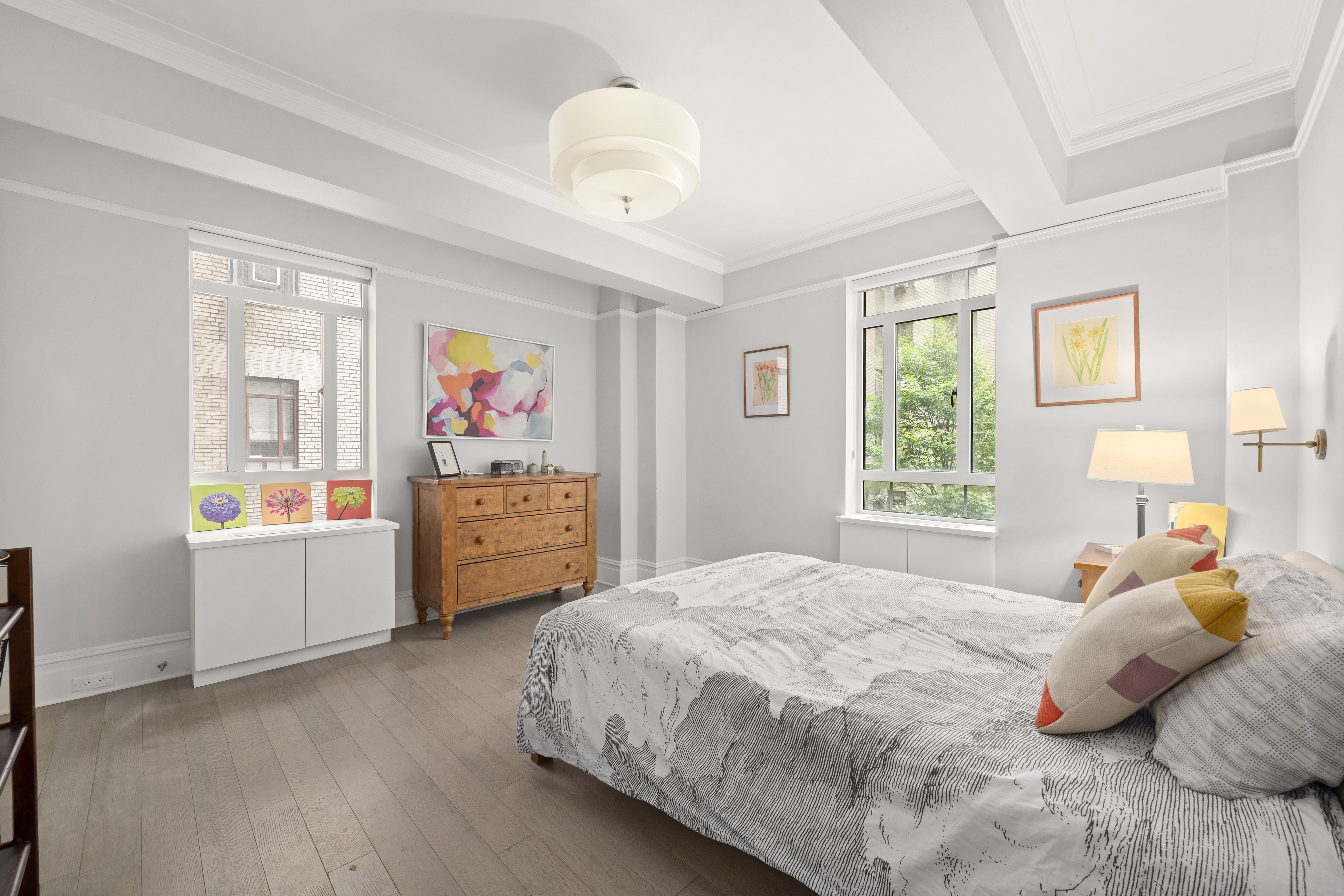 25 Central Park West, Unit 2W Manhattan, NY 10023 - Photo 4 of 12 a bedroom with a bed and wooden floor