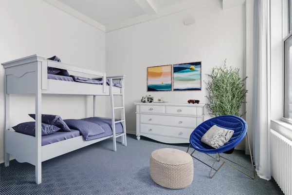 a bedroom with a bed and large window