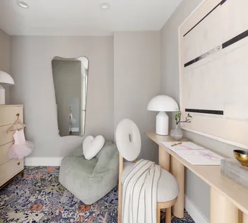 a living room with furniture and a mirror