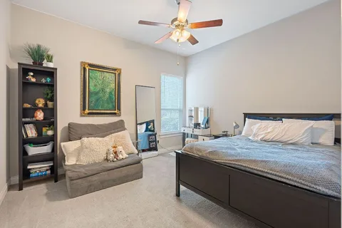 a bedroom with a bed furniture and a window