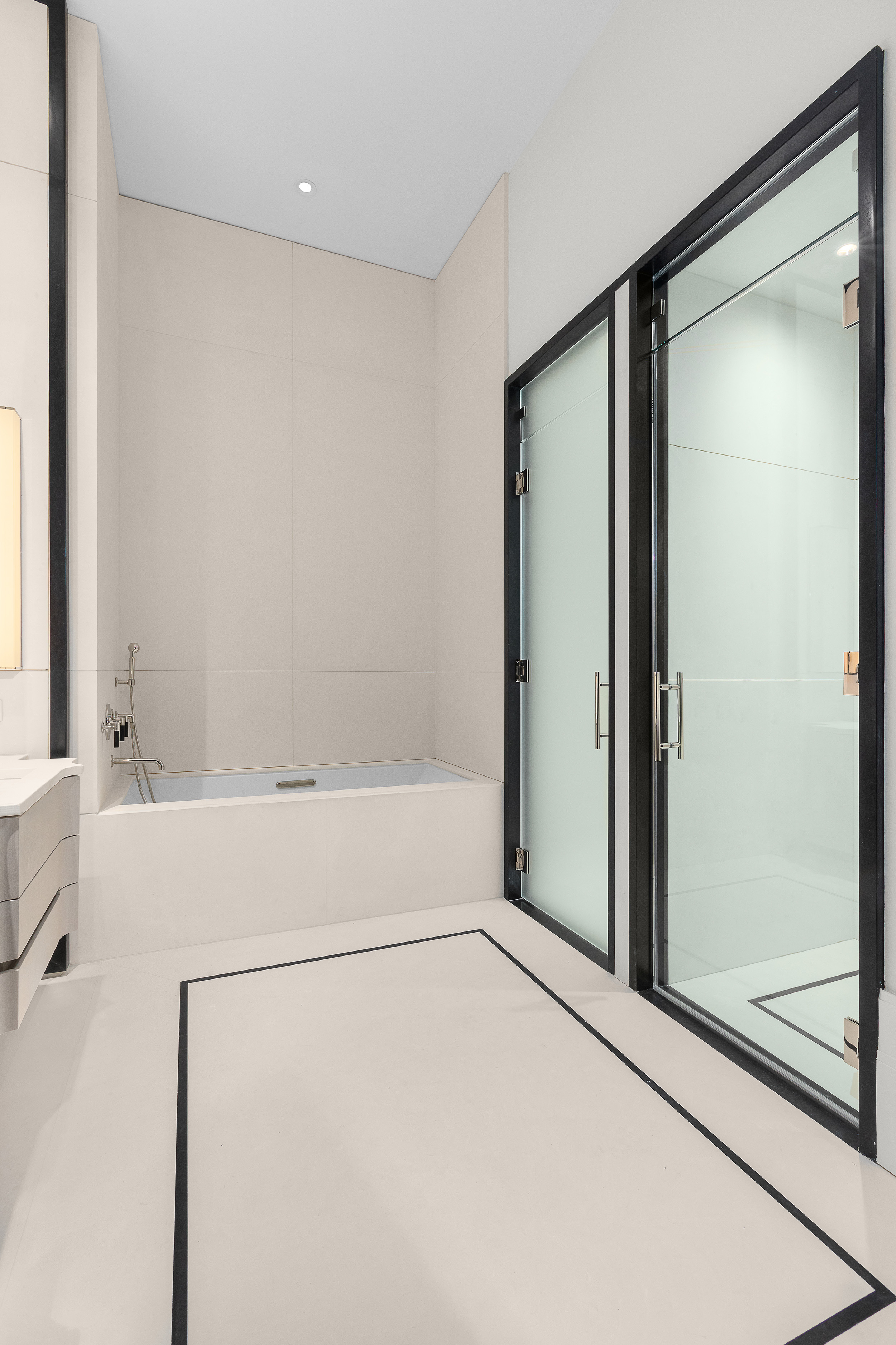 1165 Madison Avenue, Unit 3S Manhattan, NY 10028 - Photo 12 of 25 a bathroom with a shower and a bath tub