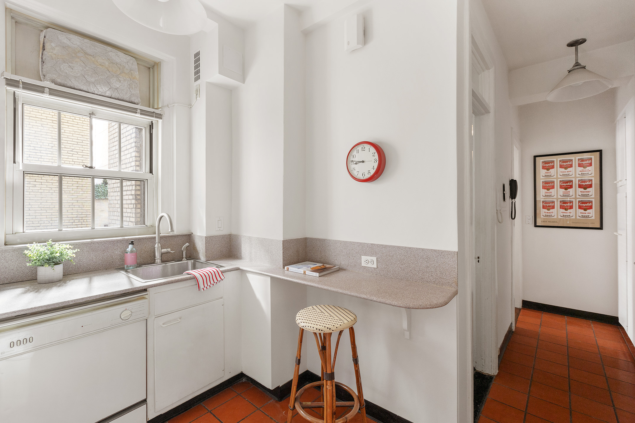 125 East 63rd Street, Unit 2B Manhattan, NY 10065 - Photo 9 of 12 a bathroom with a sink and a window