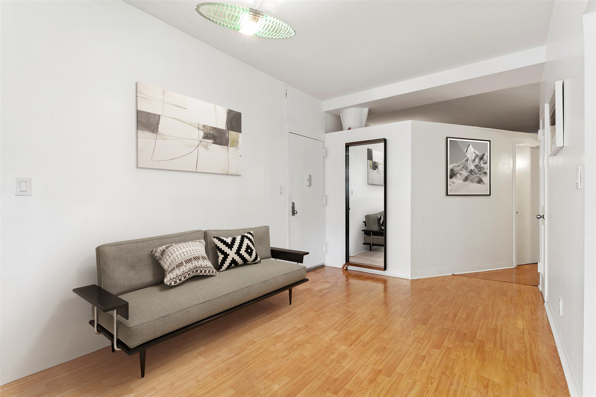 354 Broome Street, Unit 3E Manhattan, NY 10013 - Photo 2 of 5 a living room with furniture and painting on the wall