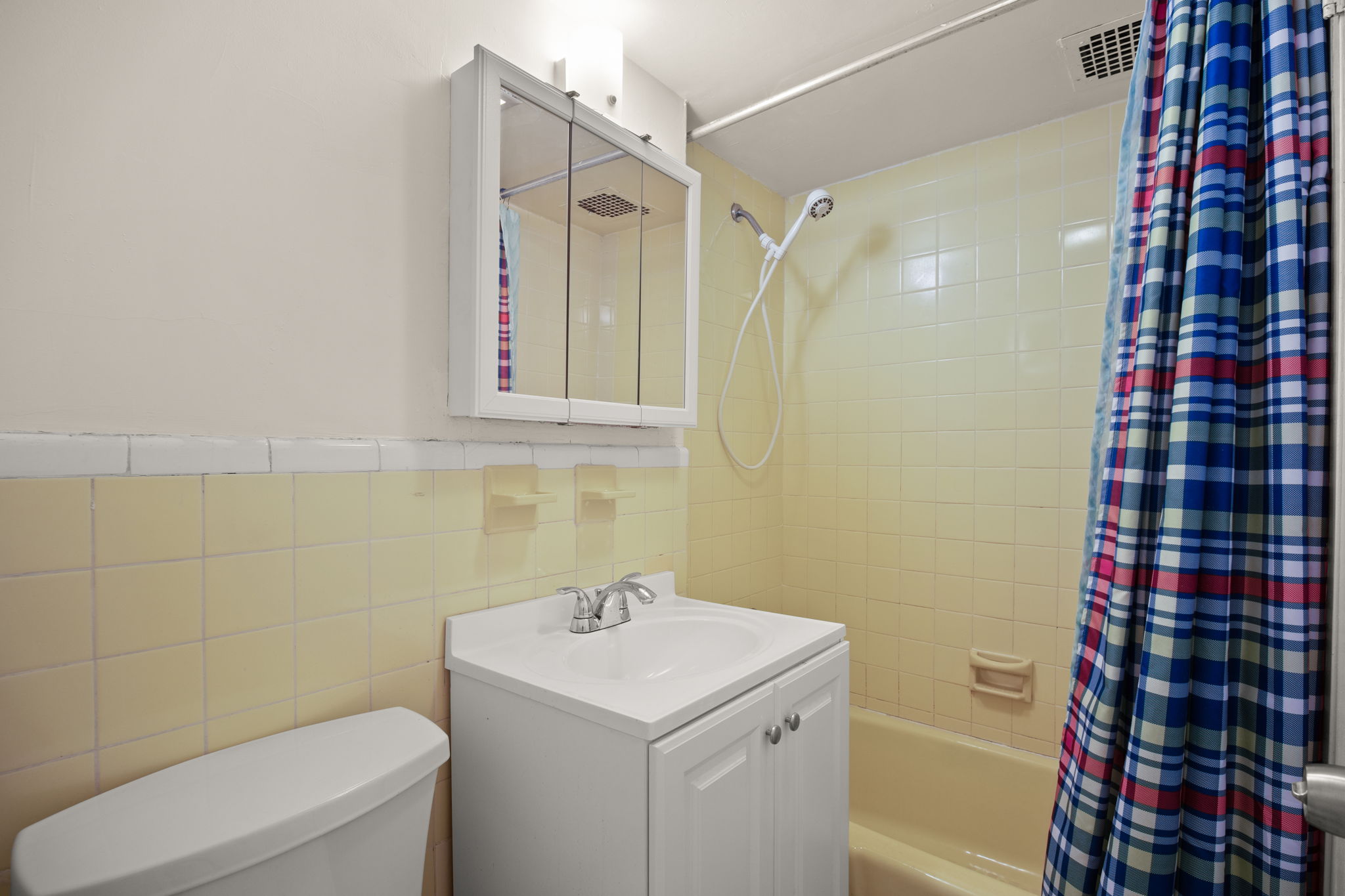 431 East 82nd Street, Unit 1A Manhattan, NY 10028 - Photo 6 of 9 a bathroom with a sink toilet and shower
