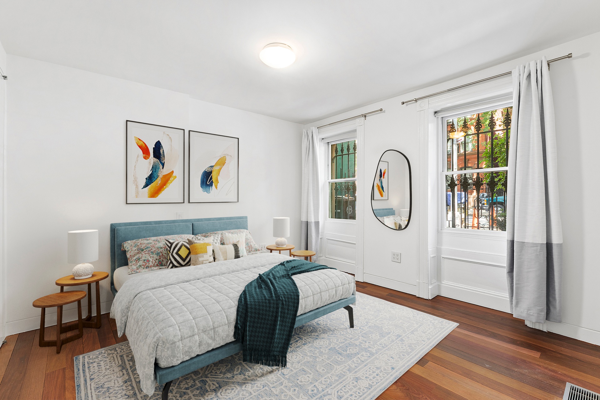 64 Clifton Place, Unit PARLOR Brooklyn, NY 11238 - Photo 12 of 17 a bedroom with a bed a table and painting on the wall