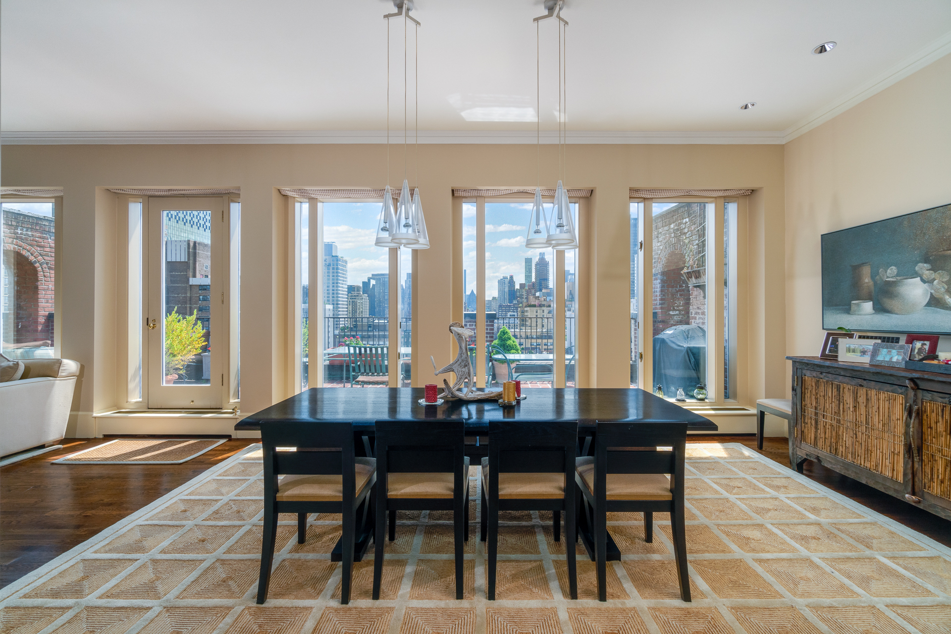 340 East 72nd Street, Unit PH Manhattan, NY 10021 - Photo 3 of 12 a dining room with furniture and wooden floor