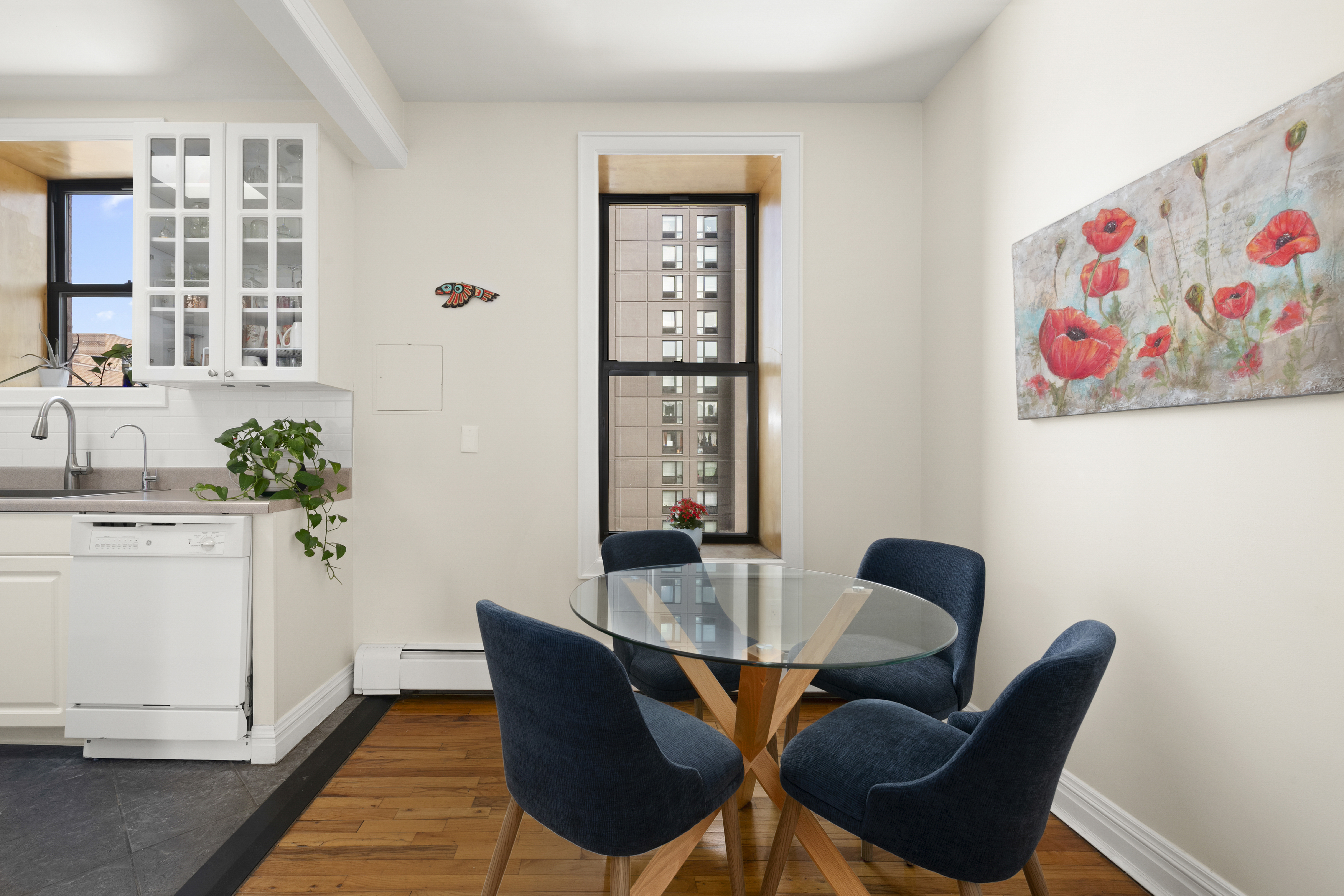 370 St Nicholas Avenue, Unit PH5B Manhattan, NY 10027 - Photo 4 of 12 a dining room with furniture and window