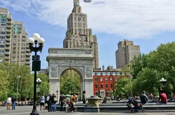 a view of swimming pool with outdoor seating and city view