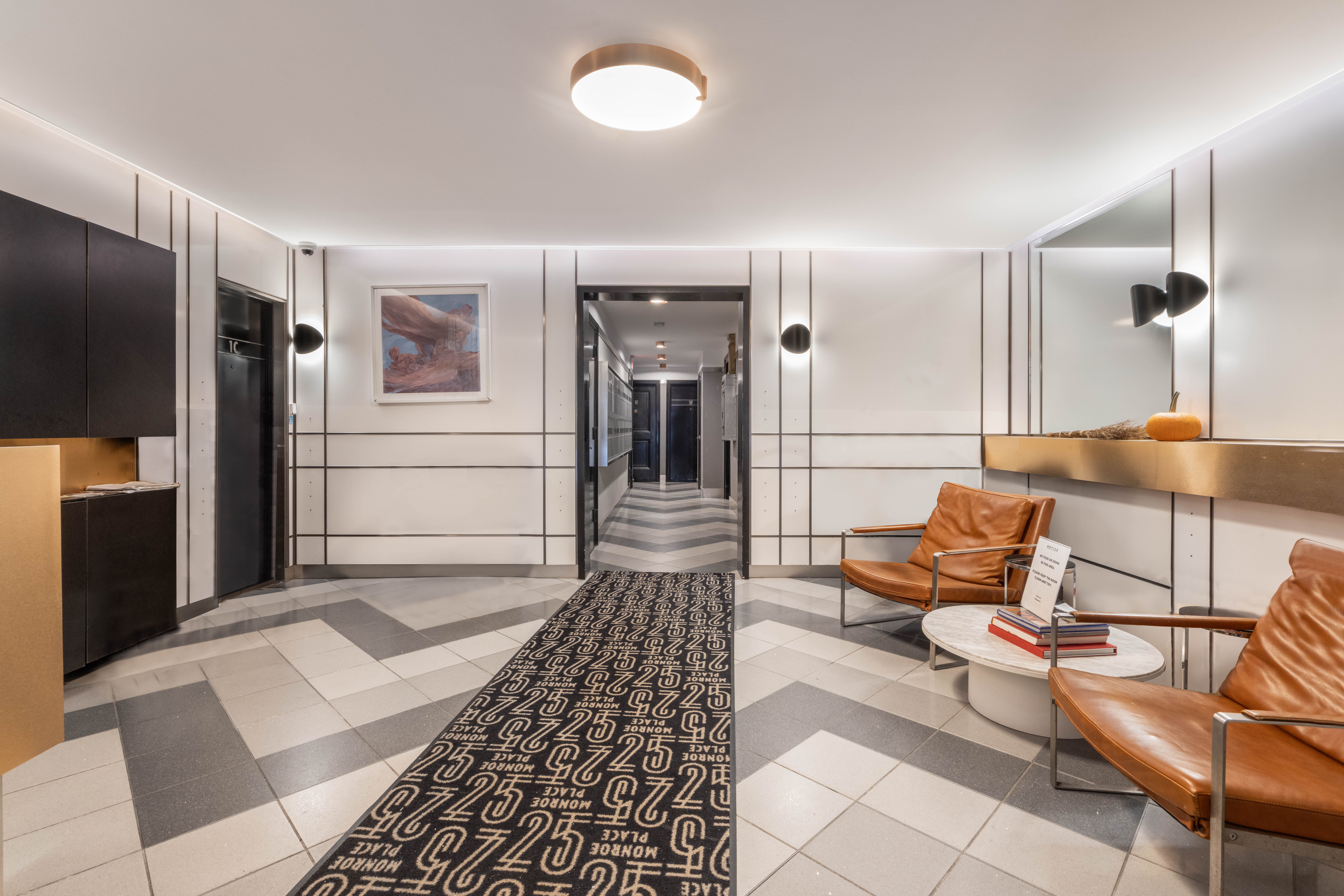 25 Monroe Place, Unit 1C Brooklyn, NY 11201 - Photo 7 of 14 a living room with furniture and a rug