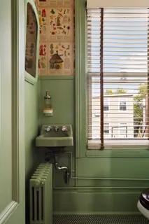 a bathroom with a sink a mirror and a window
