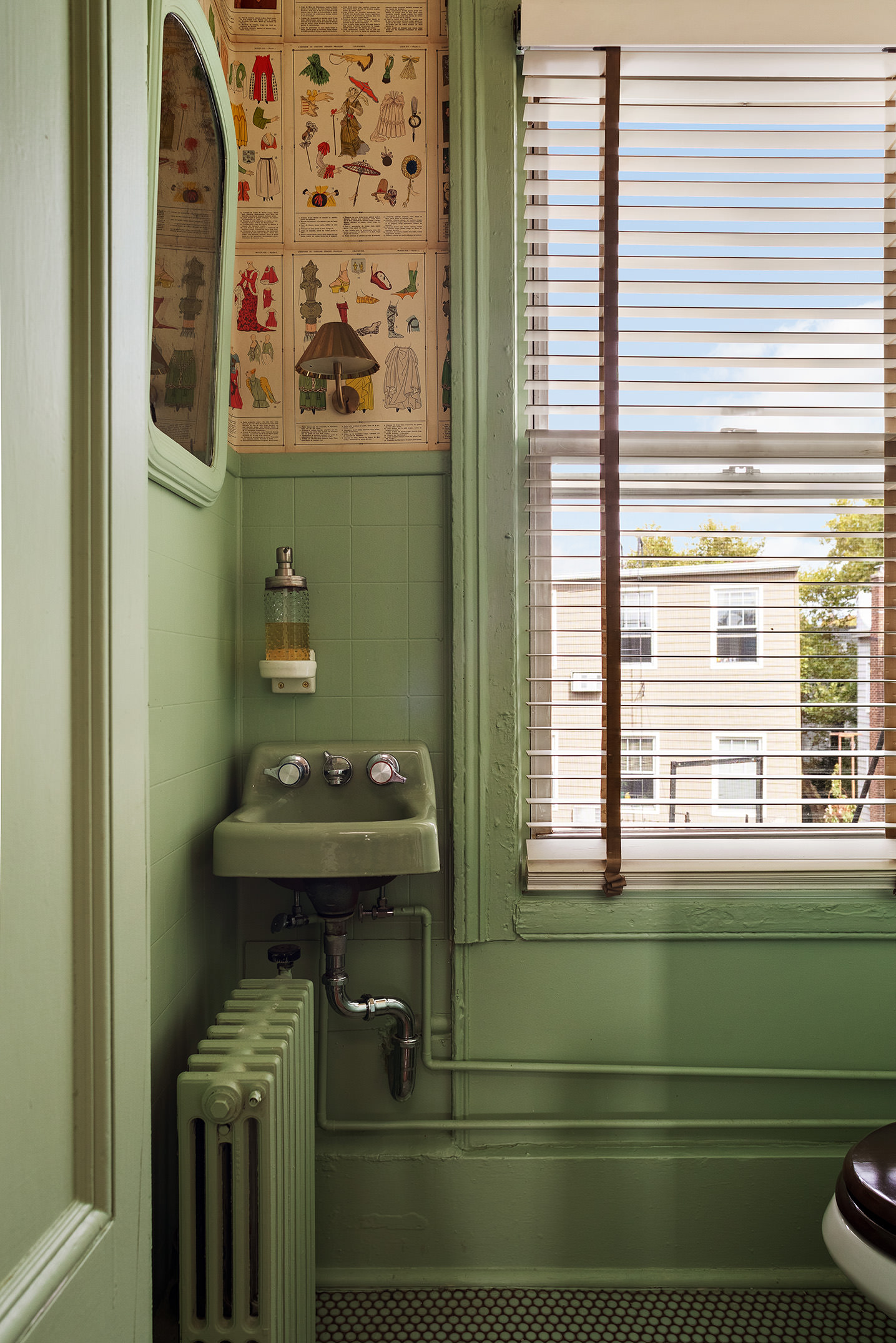 141 Calyer Street Brooklyn, NY 11222 - Photo 19 of 25 a bathroom with a sink a mirror and a window