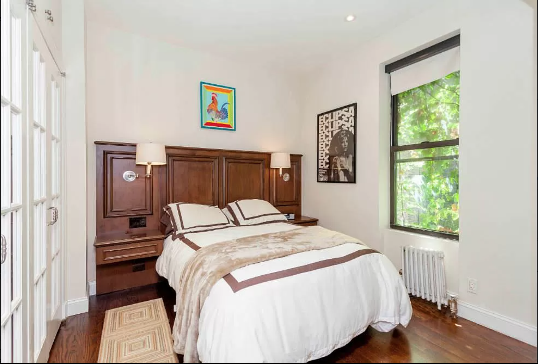 80 Charles Street, Unit 2R Manhattan, NY 10014 - Photo 3 of 5 a bedroom with a bed and a window