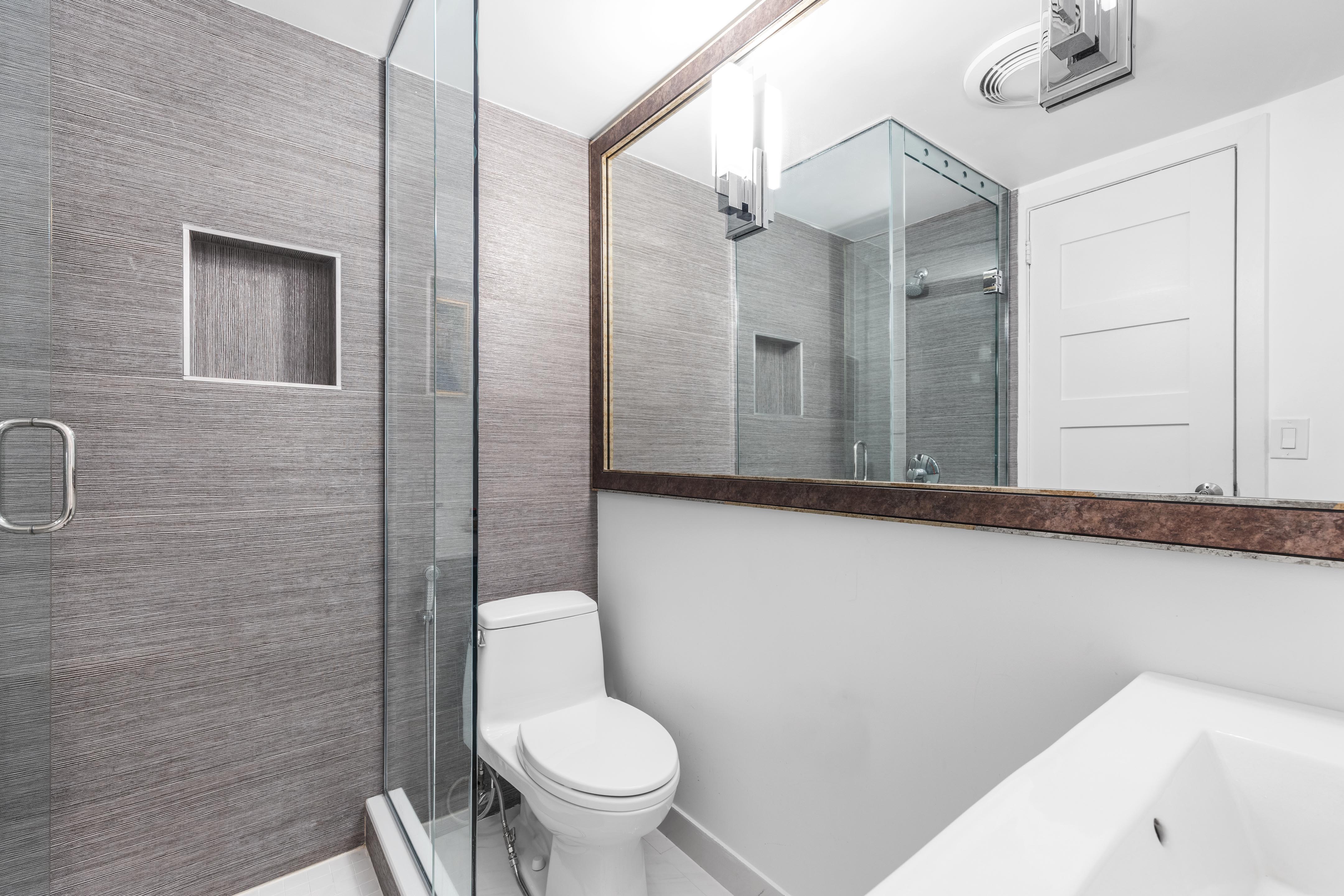 342 West 85th Street, Unit PH6AB Manhattan, NY 10024 - Photo 13 of 17 a bathroom with a toilet sink and shower