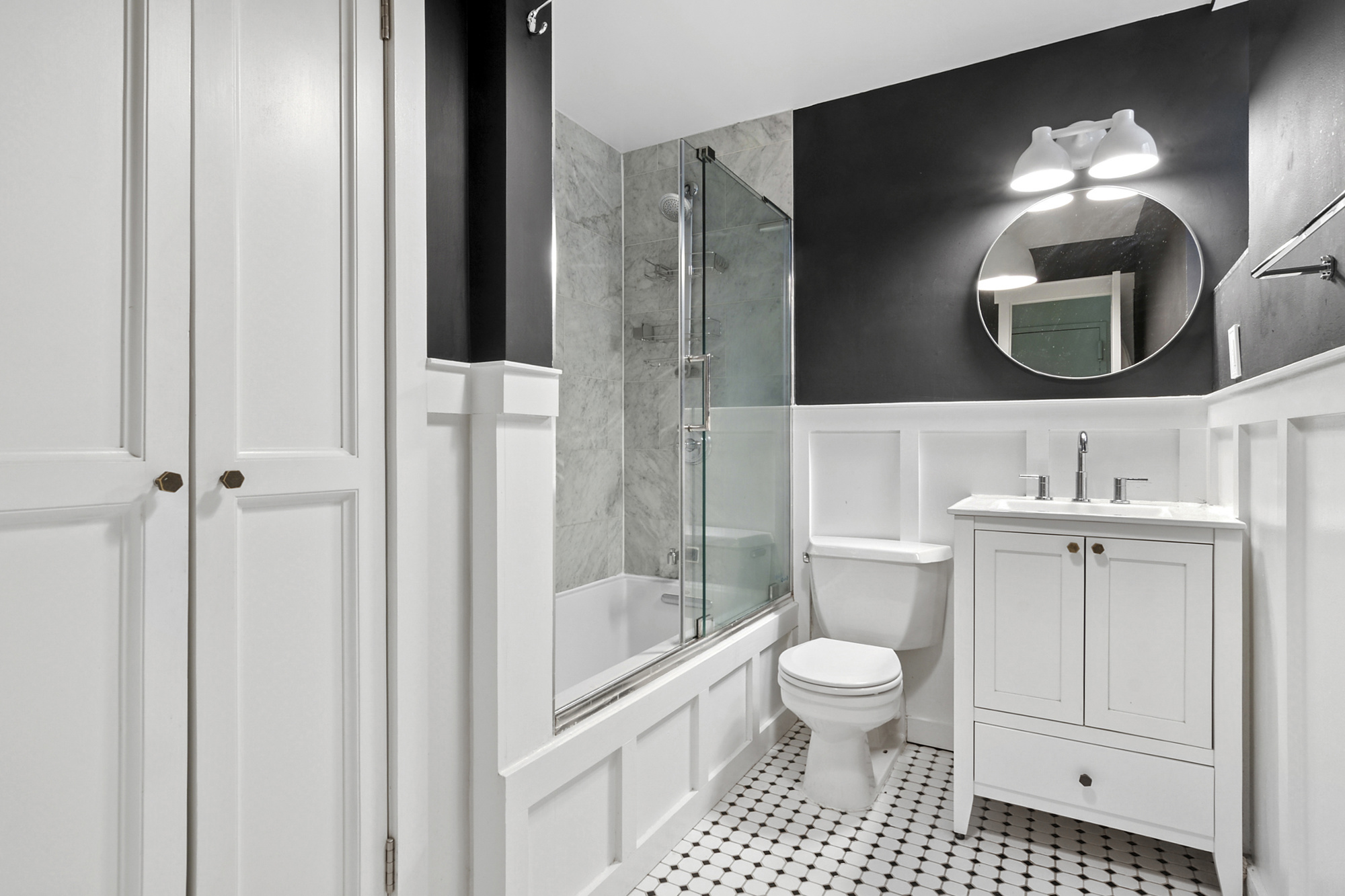 338 Prospect Place, Unit 2B Brooklyn, NY 11238 - Photo 5 of 7 a bathroom with a toilet a sink and mirror