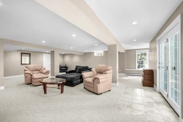 a living room with furniture and a large window