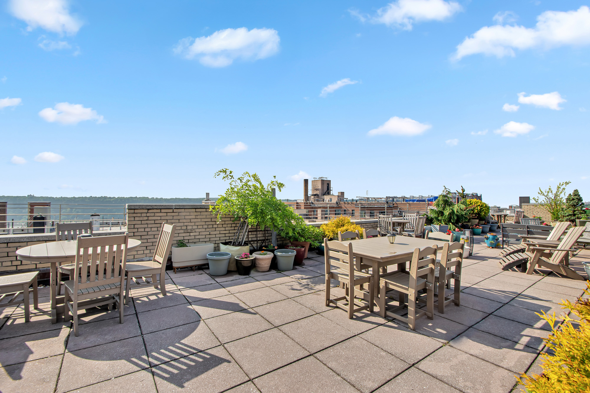 200 Pinehurst Avenue, Unit 5C Manhattan, NY 10033 - Photo 14 of 17 a view of a terrace with furniture and stove