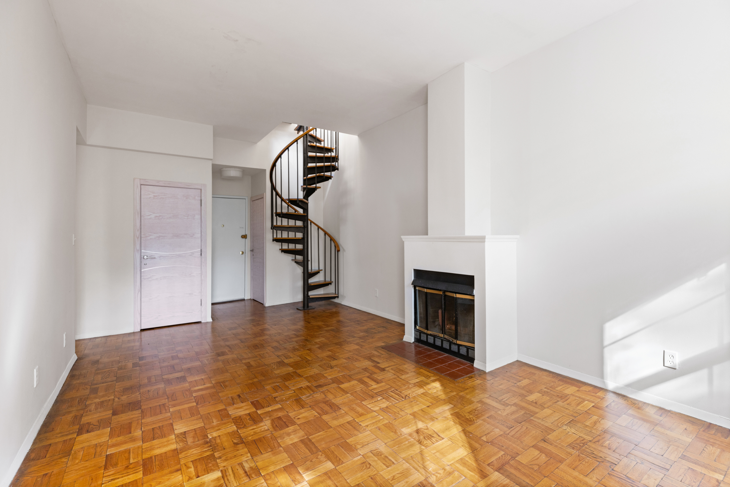 136 East 30th Street, Unit 3R Manhattan, NY 10016 - Photo 19 of 23 a view of empty room with fireplace