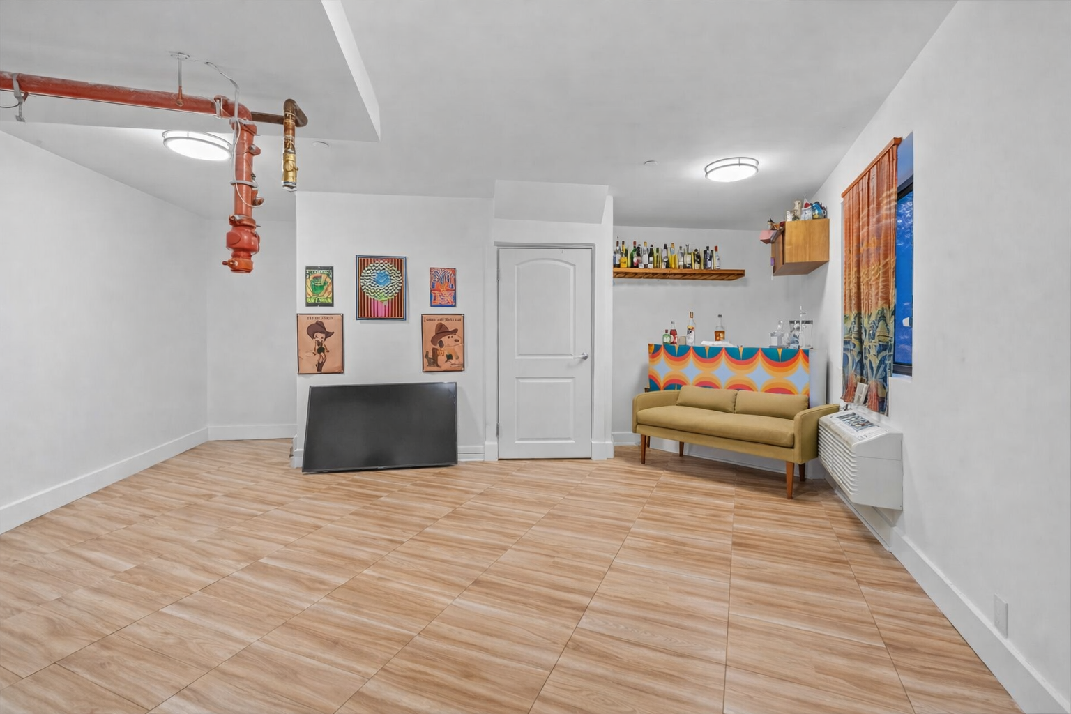 83 Suydam Street, Unit TWOFAMILY Brooklyn, NY 11221 - Photo 6 of 11 a view of a livingroom with wooden floor and furniture