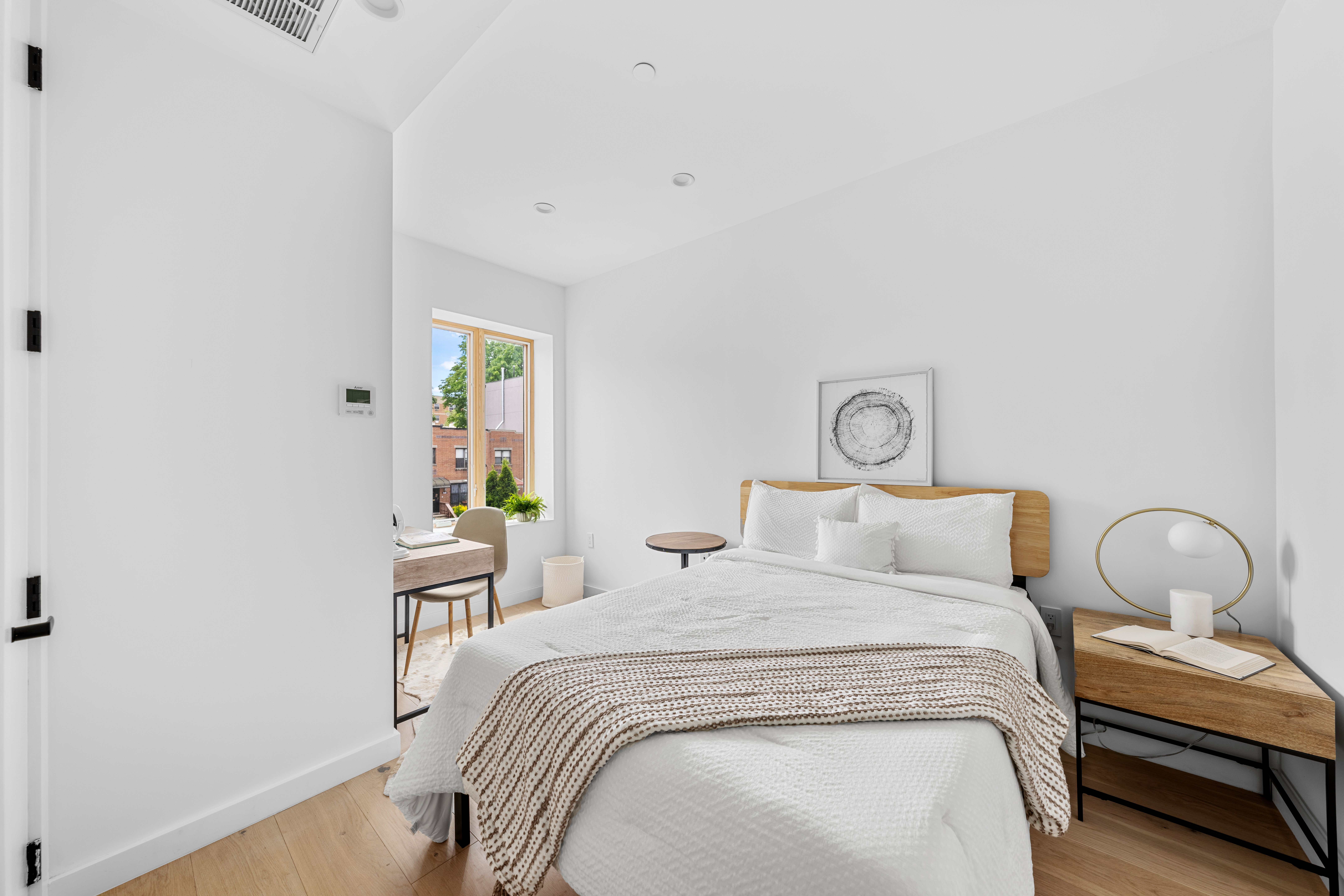 545 Lexington Avenue, Unit 1 Brooklyn, NY 11221 - Photo 7 of 19 a bedroom with a bed and a window