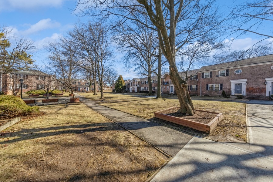 224-46 Horace Harding Expressway, Unit 630 Queens, NY 11364 - Photo 24 of 29 a front view of a building with trees