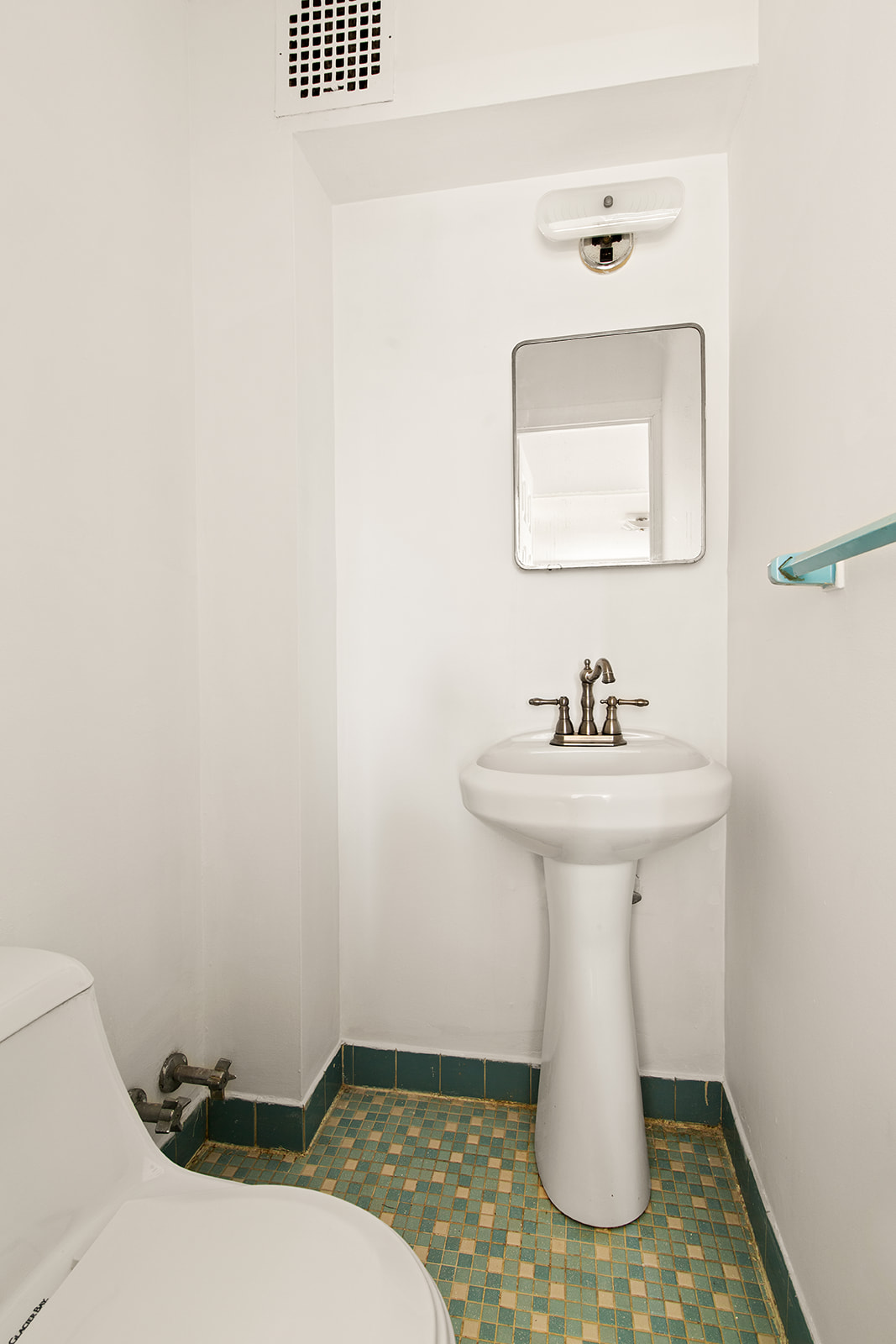 572 92nd Street Brooklyn, NY 11209 - Photo 12 of 20 a bathroom with a sink toilet and mirror