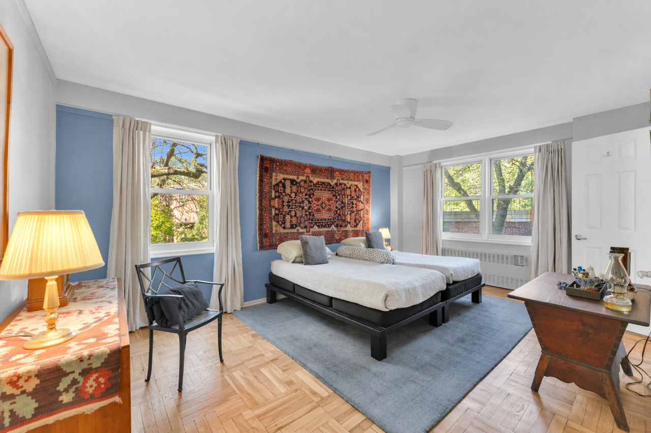 4555 Henry Hudson Parkway West, Unit A310 Bronx, NY 10471 - Photo 9 of 16 a living room with furniture and a window